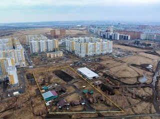 В активно развивающемся районе Красноярска выставлен на продажу участок для строительства жилья